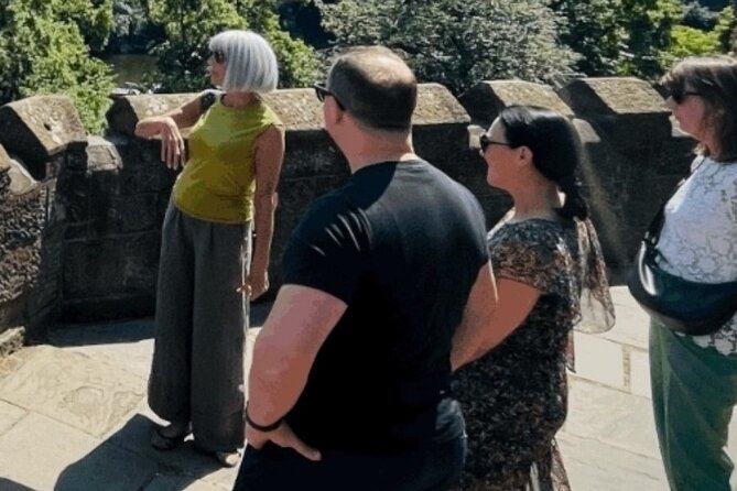 Chester Food Tour: Unique Food With Drinks & Sightseeing - Eastgate Clock and local produce on the walls