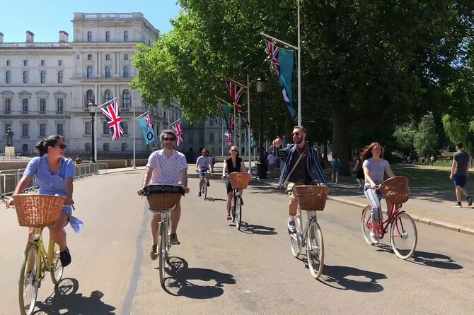 London Bike Tour: Landmarks, Secret Gems, Pub Stop & Street Art - Crossing Westminster Bridge beneath Big Ben