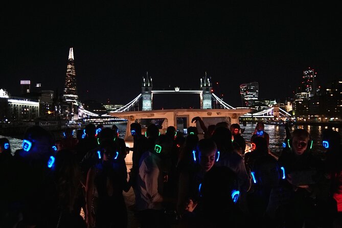 Silent Disco London Thames Boat Party - Under Tower Bridge with London lit up