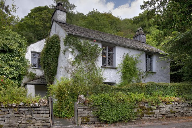 Windermere & Lake District Tour from Manchester Including Cruise - Coniston Water and the road between the stops